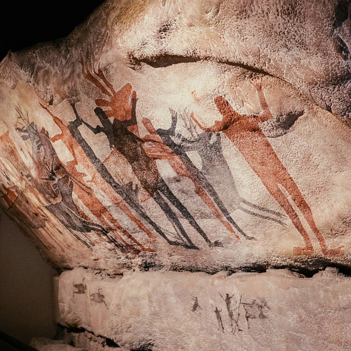 human figure painting on a rock