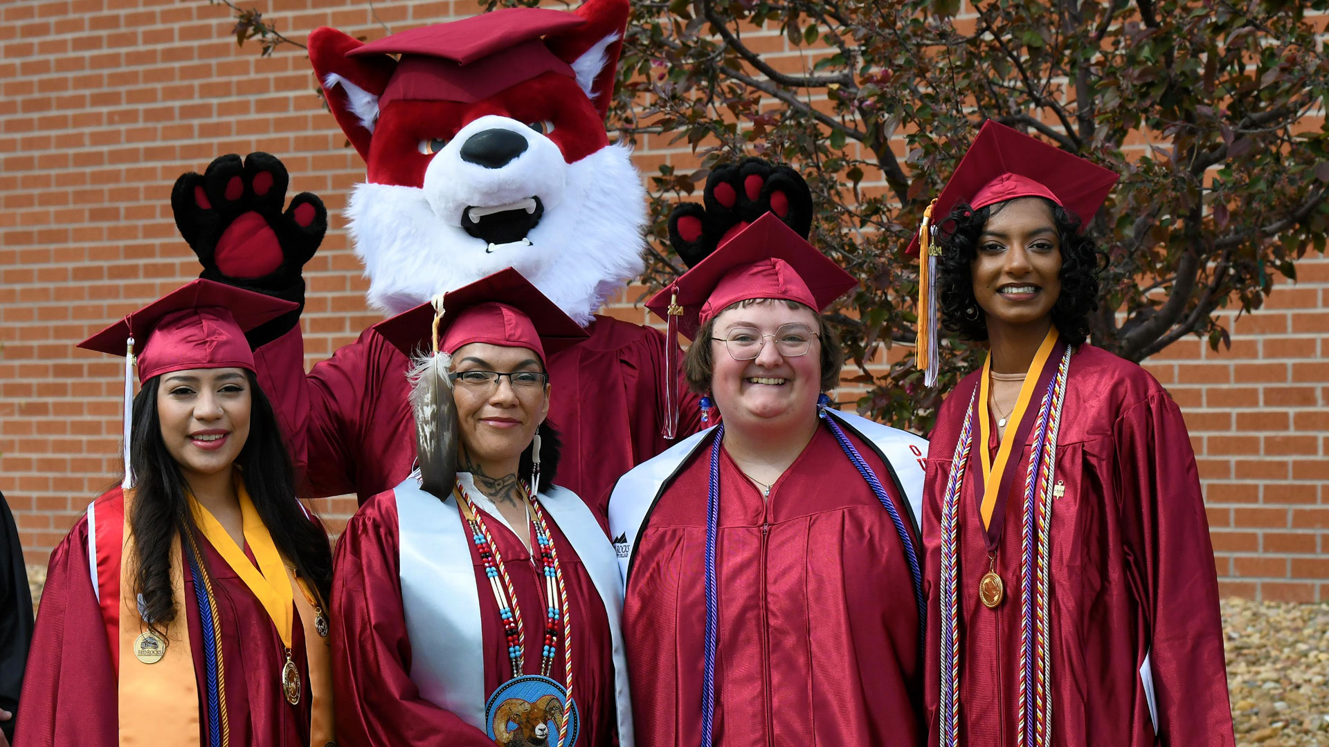 Students at Graduation with mascot