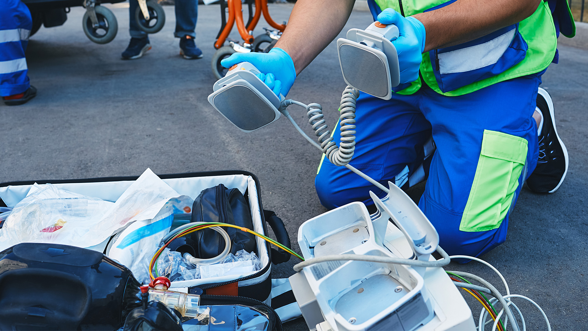 Emergency Medical Technician using equipment