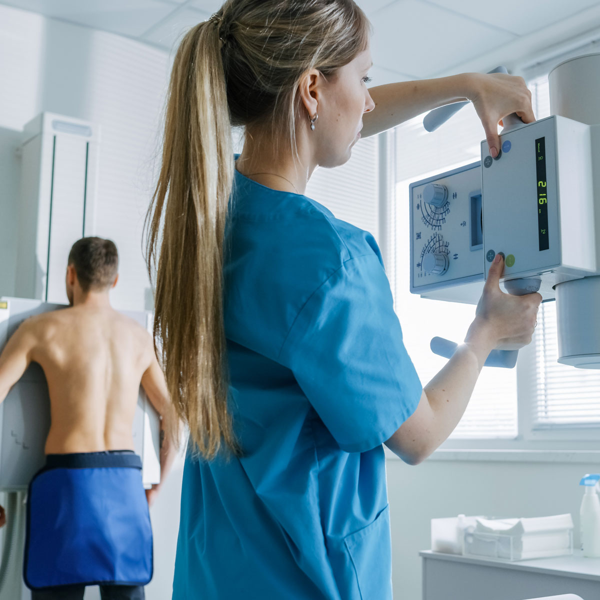 woman working with medical digital imaging machine