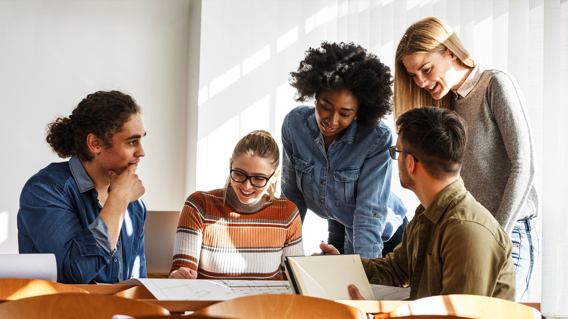 Group of students gathered around a table