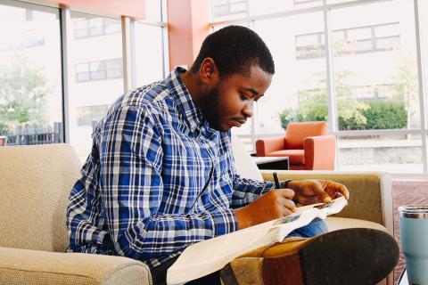 male student in chair