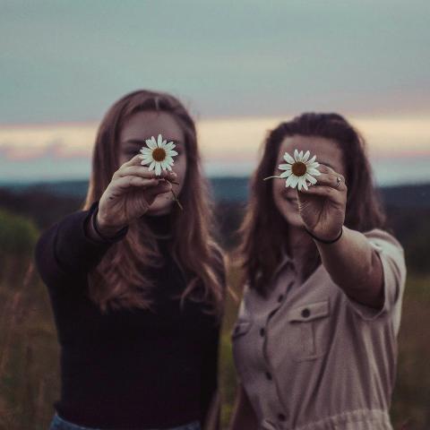 2 girls with sunflowers