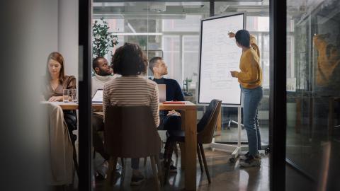 People around a table in marketing office