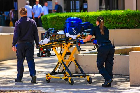 two Advanced EMT arriving on scene with equipment