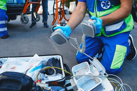 Emergency Medical Technician holding equipment