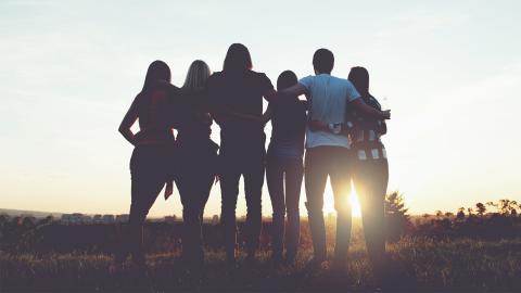 Group of people watching the sun set