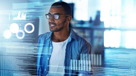 Man looking at computer code