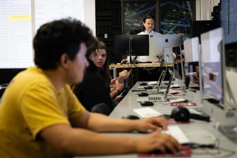 students using computers in a classroom